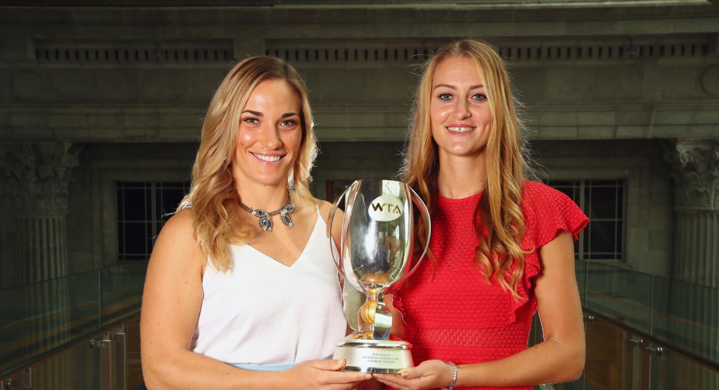Timea Babos and Kristina Mladenovic with the Martina Navratilova Trophy (Getty)