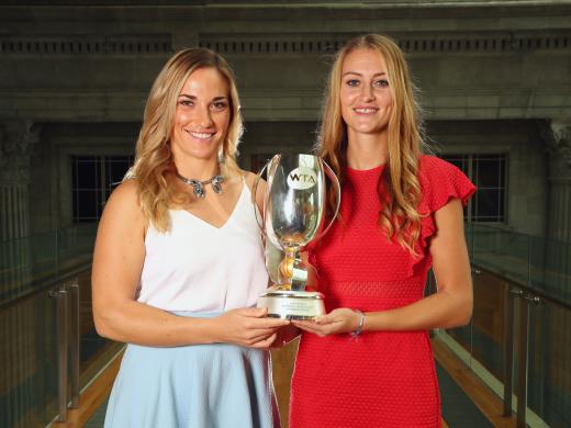 Timea Babos and Kristina Mladenovic with the Martina Navratilova Trophy (Getty)