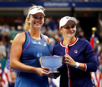 Ashleigh Barty and Coco Vandeweghe holding 2018 US Open Womens Doubles Trophy