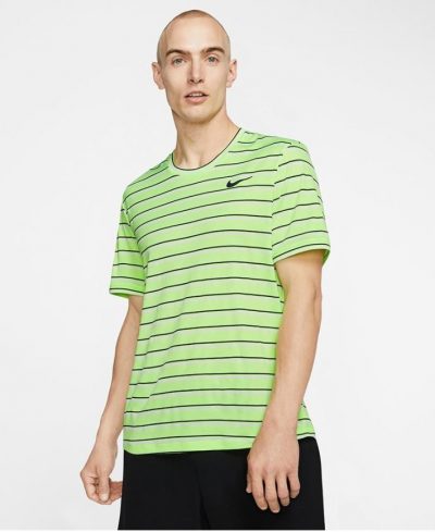 Model in Nike Mens Team Court Dry Graphics Top Ghost Green